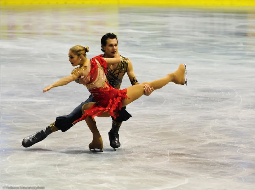 Stepan and Stephanie performing a pair element during competition